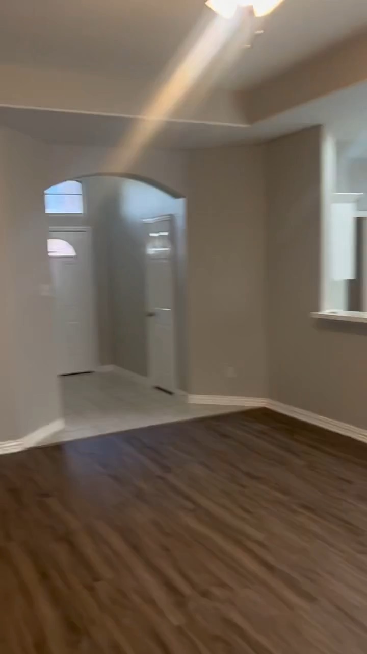 Walk through of a kitchen and living area renovation with new flooring and paint